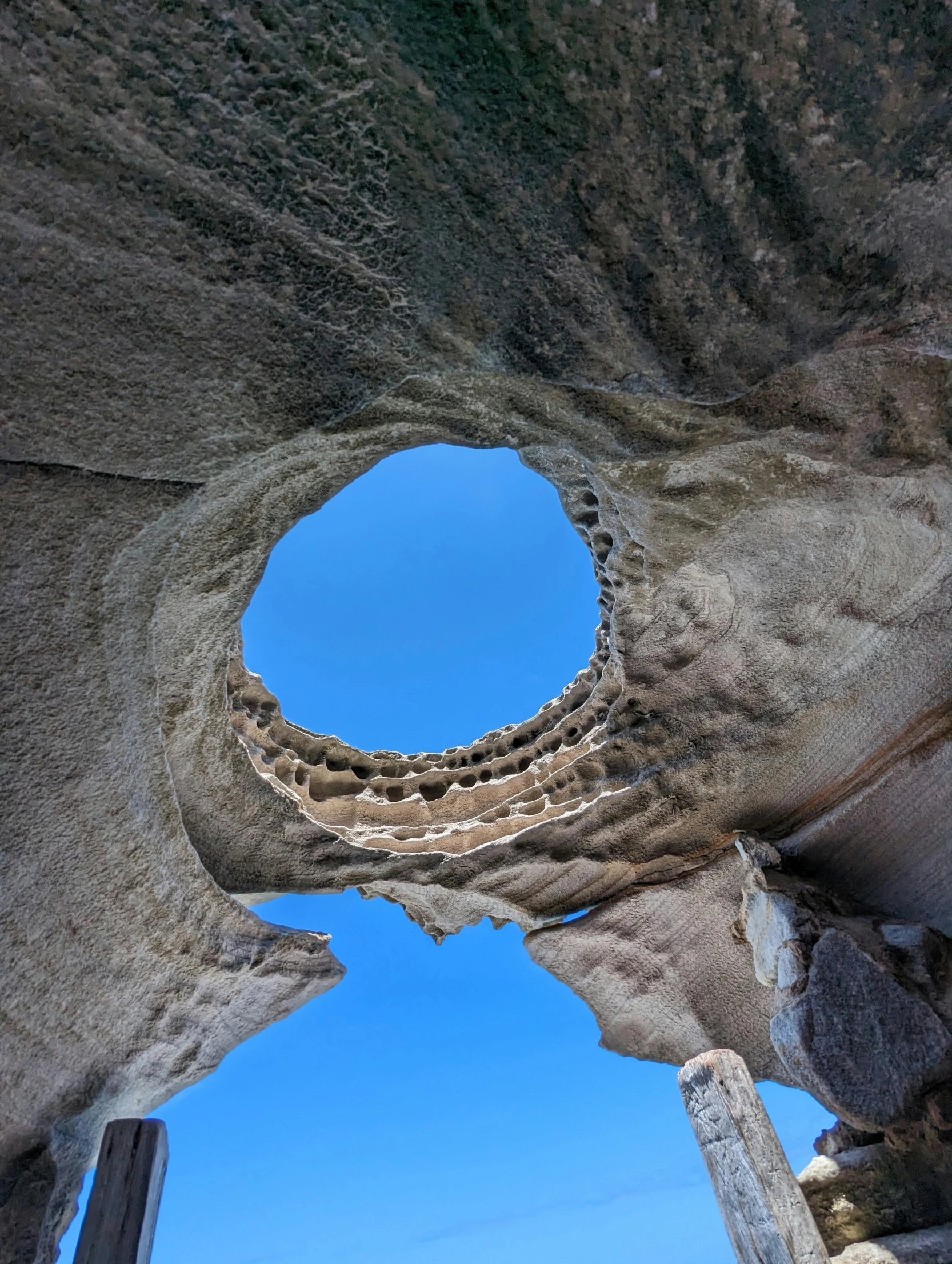 the view inside of a stone arch from the ground