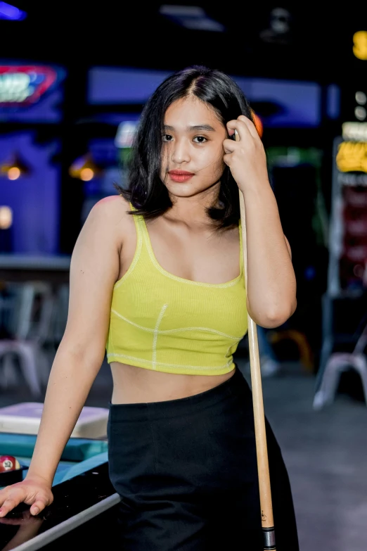 a young lady with black hair is holding an umbrella