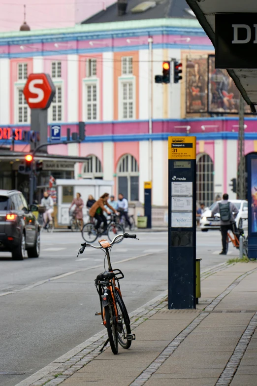 bicycle parked along side a busy city street