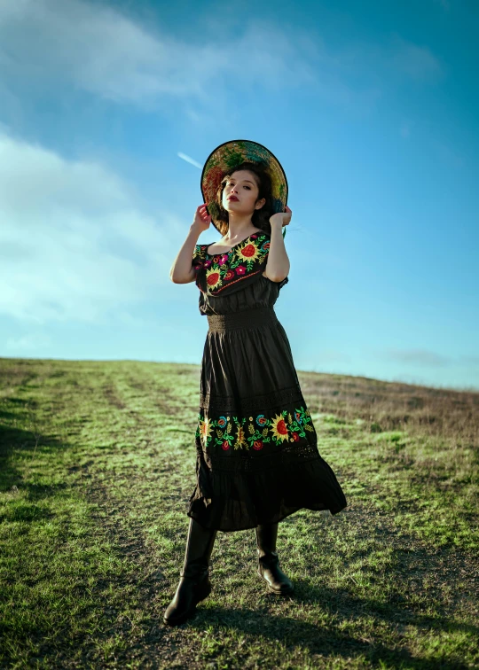 an attractive young woman in a traditional mexican costume