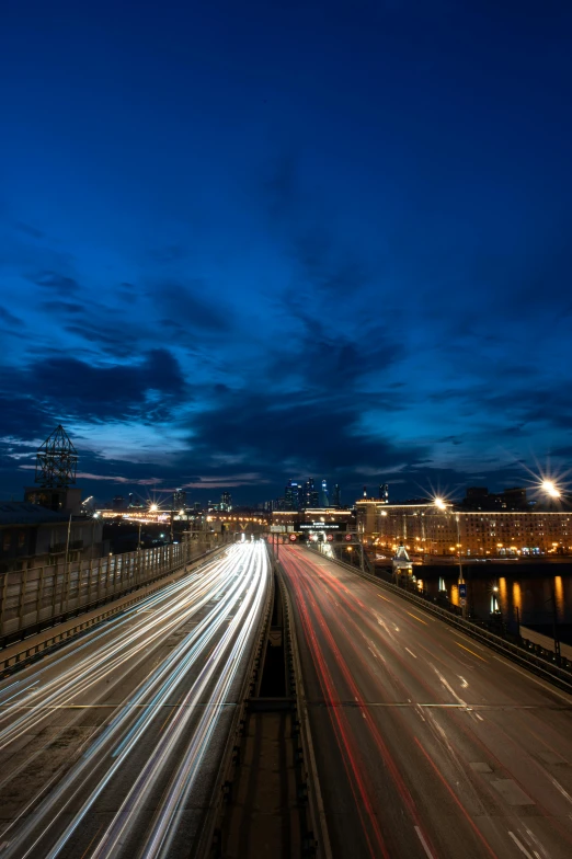 the time lapse po shows multiple cars on the highway at night