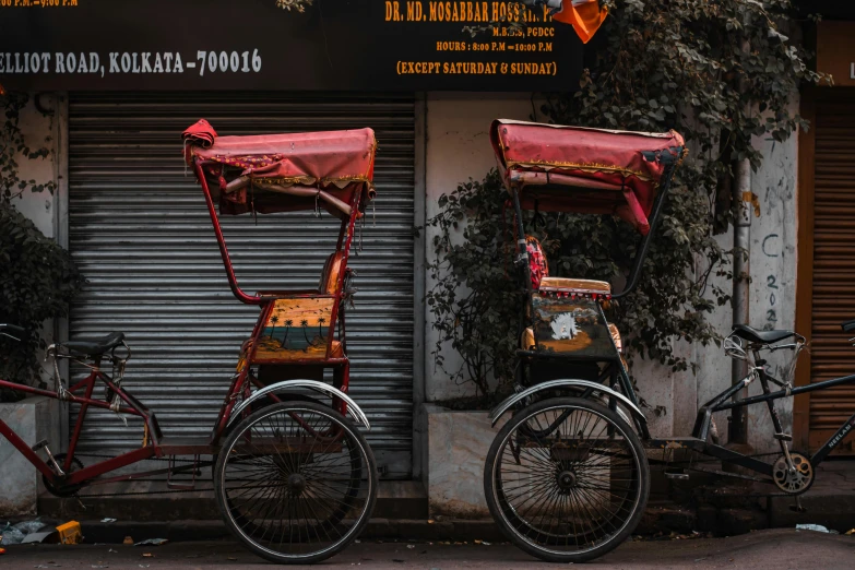 two bikes and a bicycle in front of a store