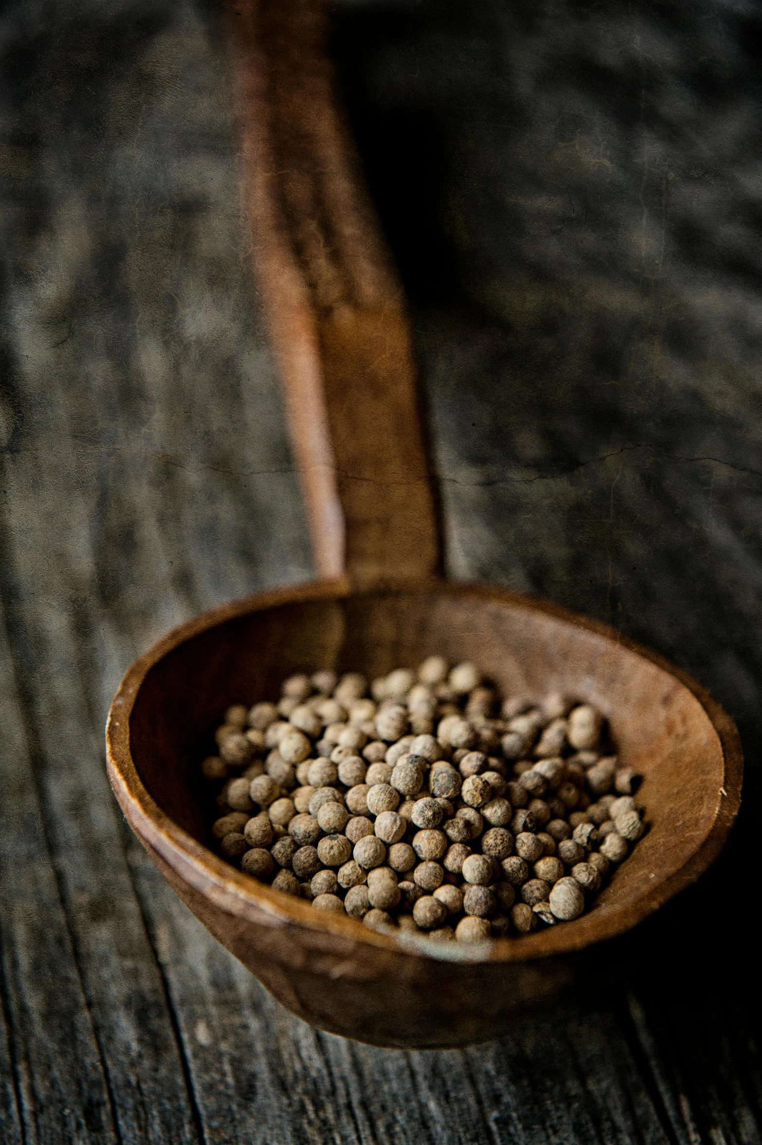 a wooden spoon with some food in it