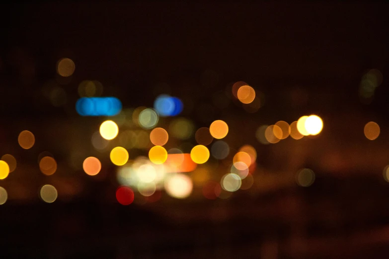 a blurry image of several lights in the dark