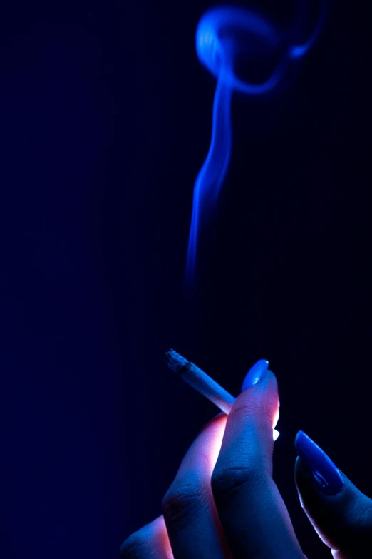 a person's hands lighting the lighter over their head