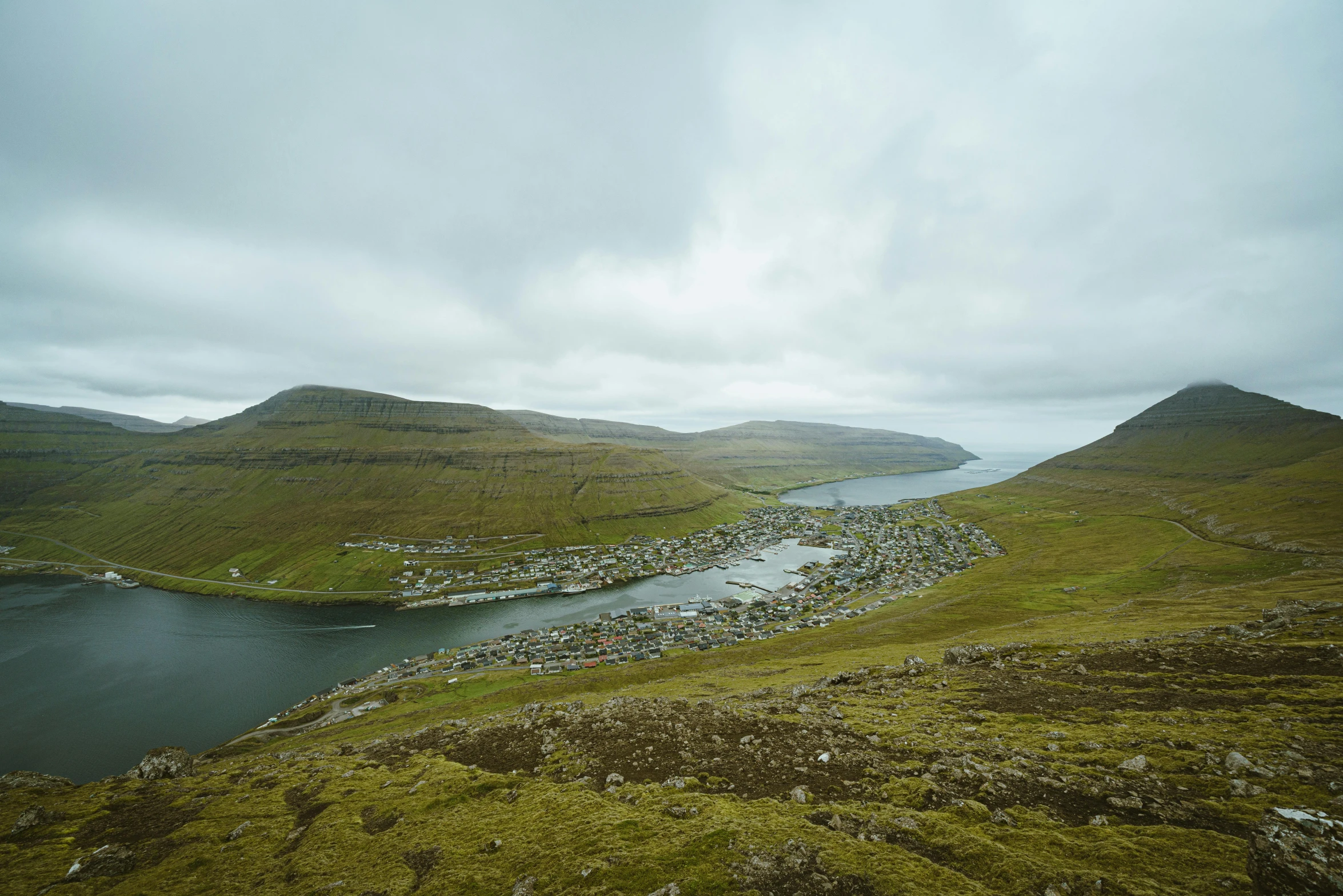 there is an expansive po of the sea and mountains