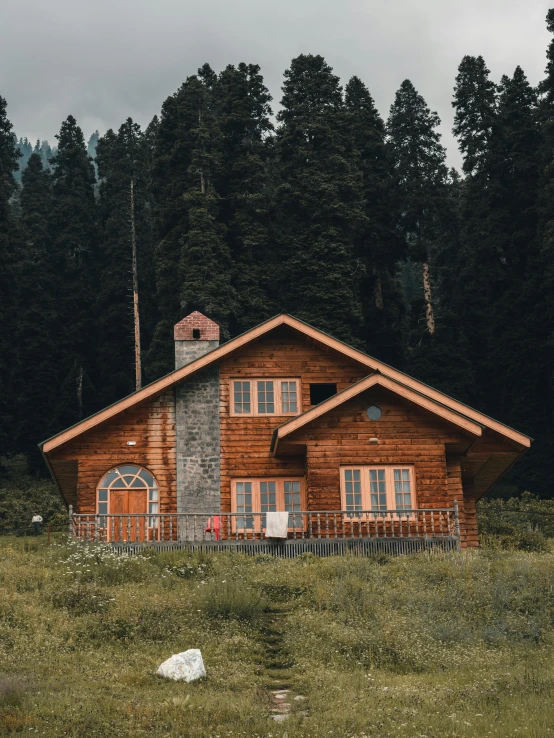 a cabin in the mountains on an overcast day