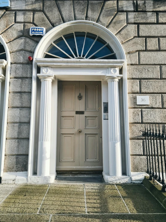 the front doors to an old style building