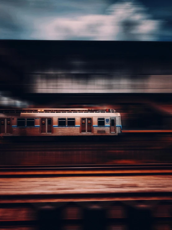 a train on a train track, in the dark