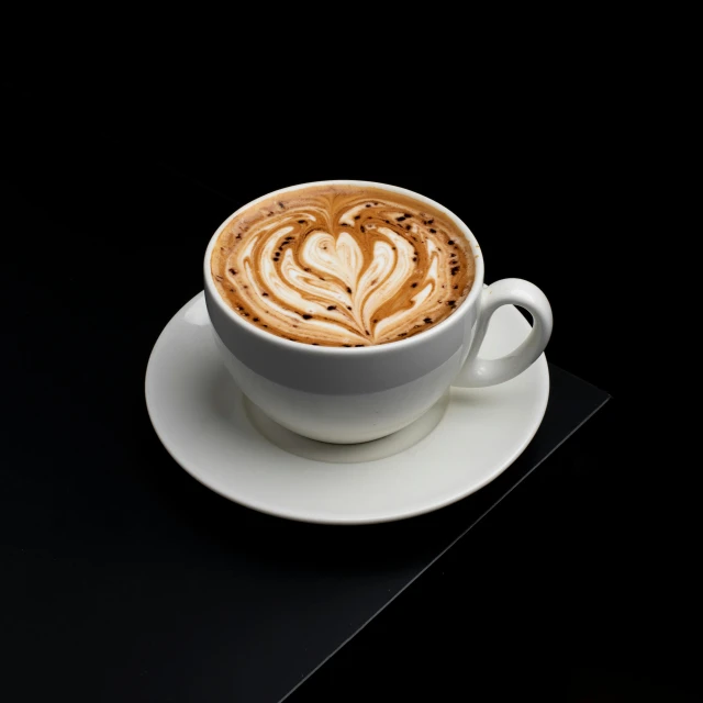 coffee with foamy frothy pattern in white cup