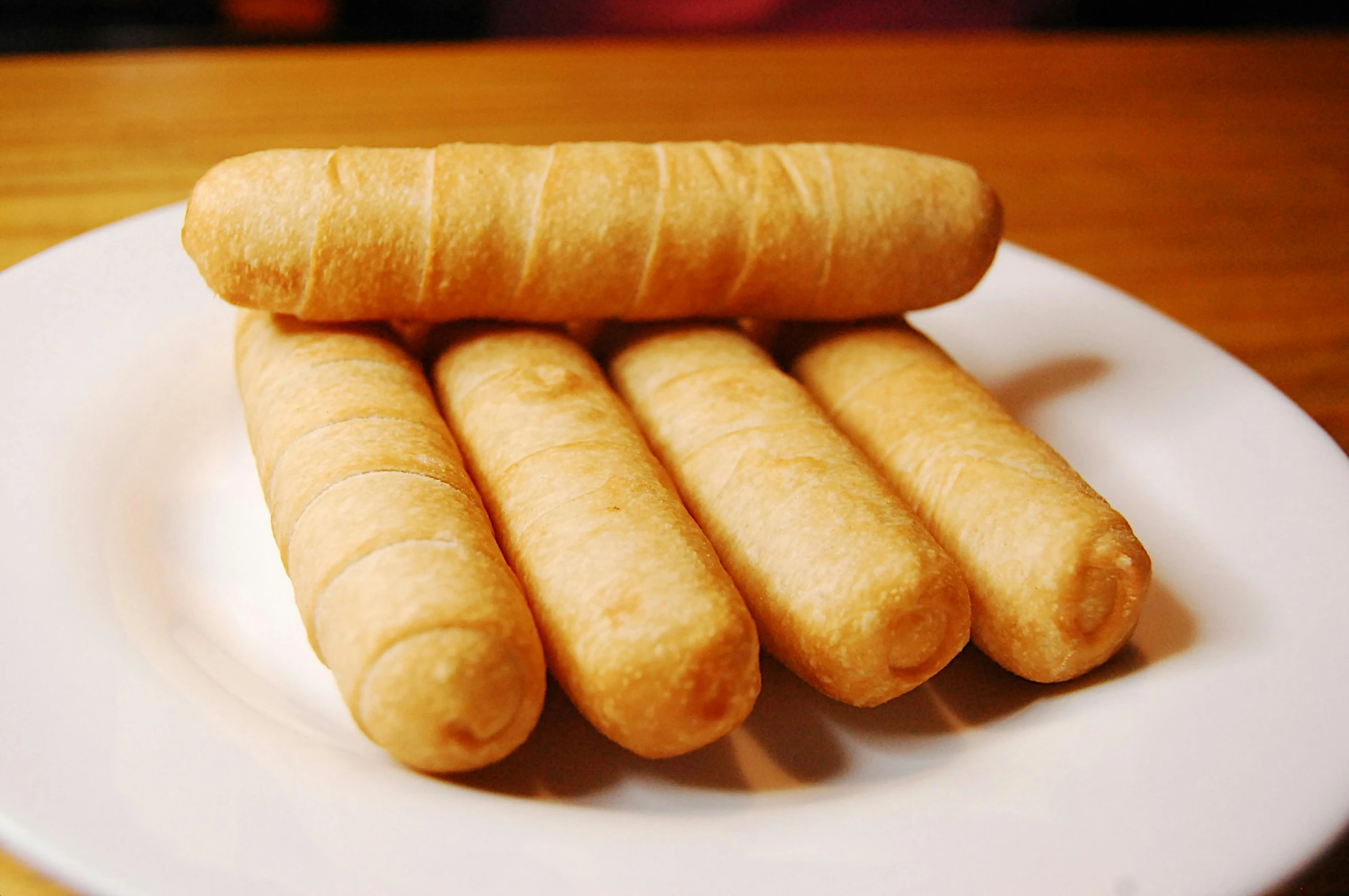 two types of bread sticks on a plate