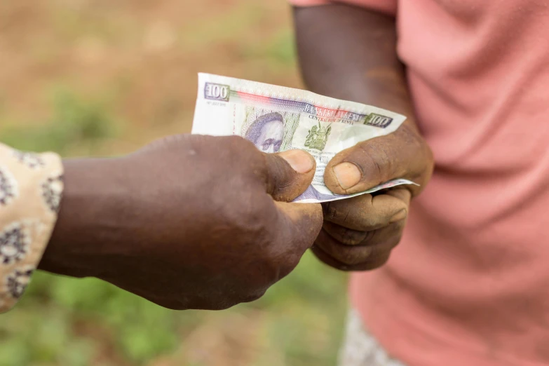 a person holds money in their hands