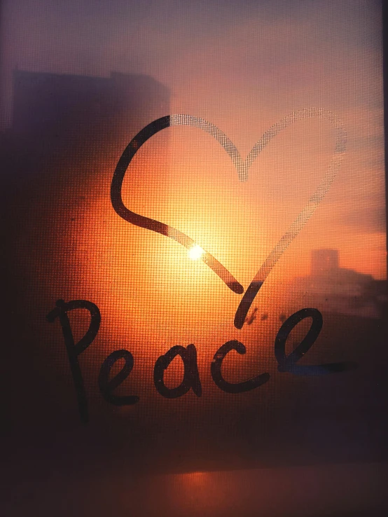 the word peace written in an image of sunset