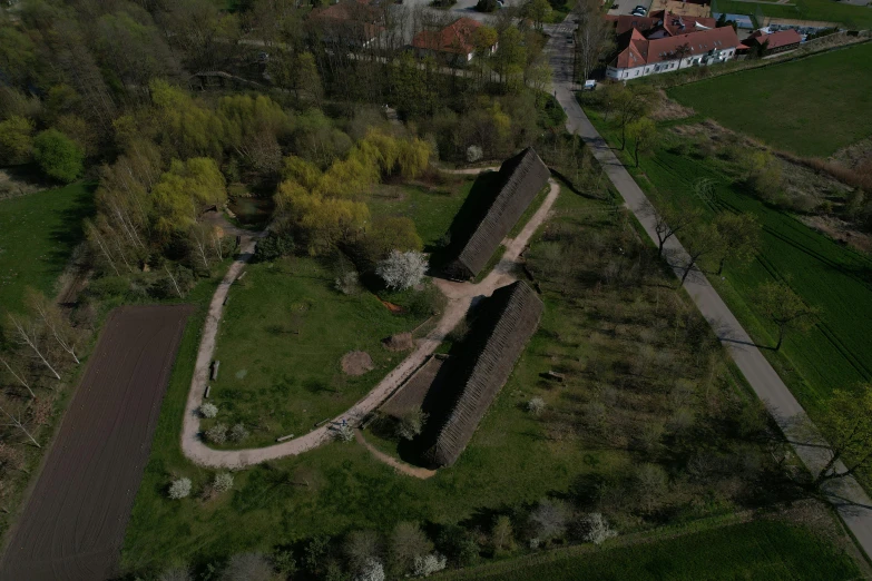 an aerial view of a rural farm and old buildings