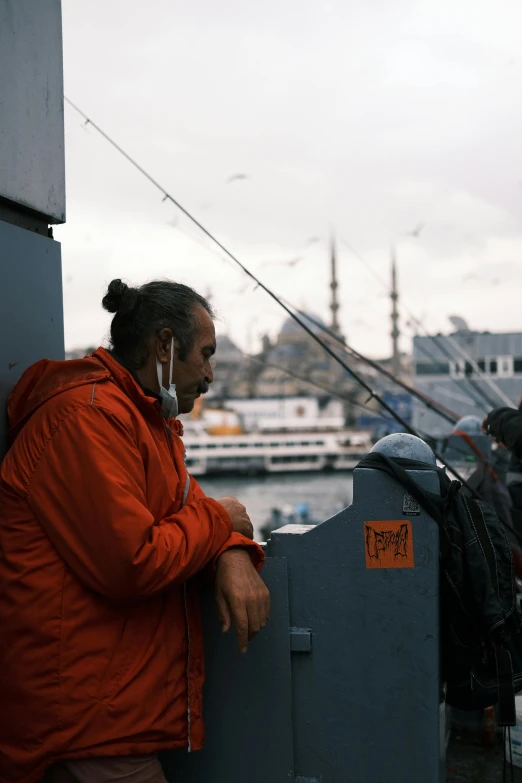 man at a fish finder's booth using cellphone