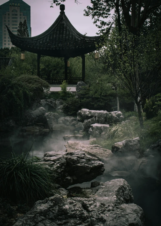 a stone path leads to an asian pavilion