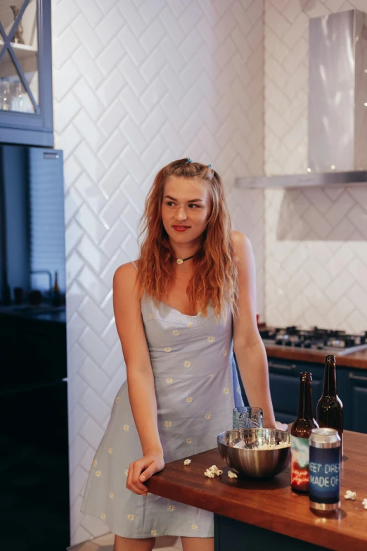 a girl is preparing food in a kitchen