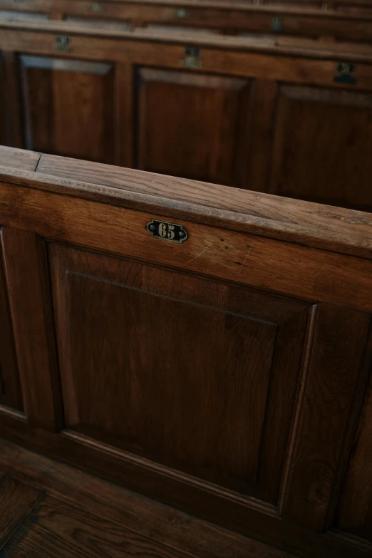 a set of brown cabinets is shown with a door handle