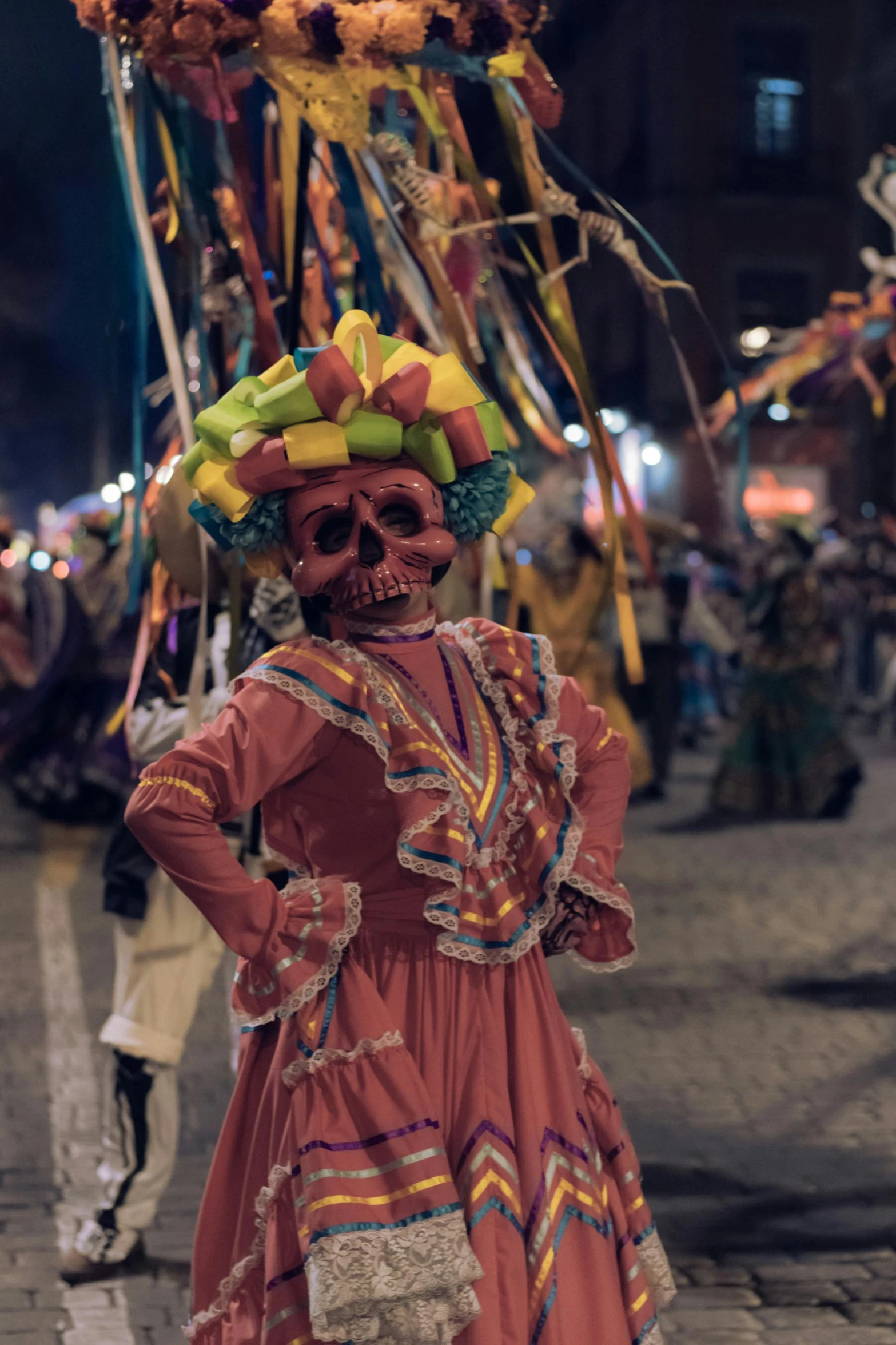 an elaborately decorated day of the dead costume in a mexican - themed festival