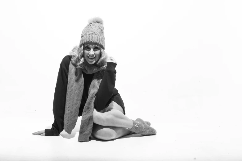 a black and white po of a woman wearing a hat