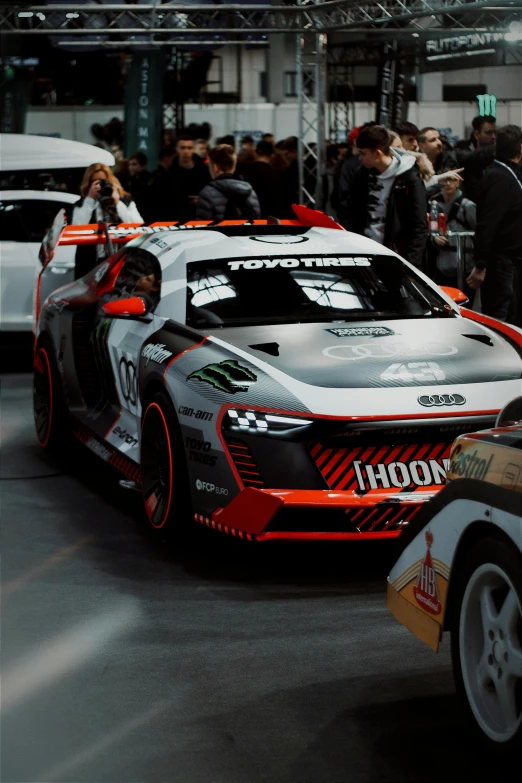 the sports cars are lined up in a parking lot