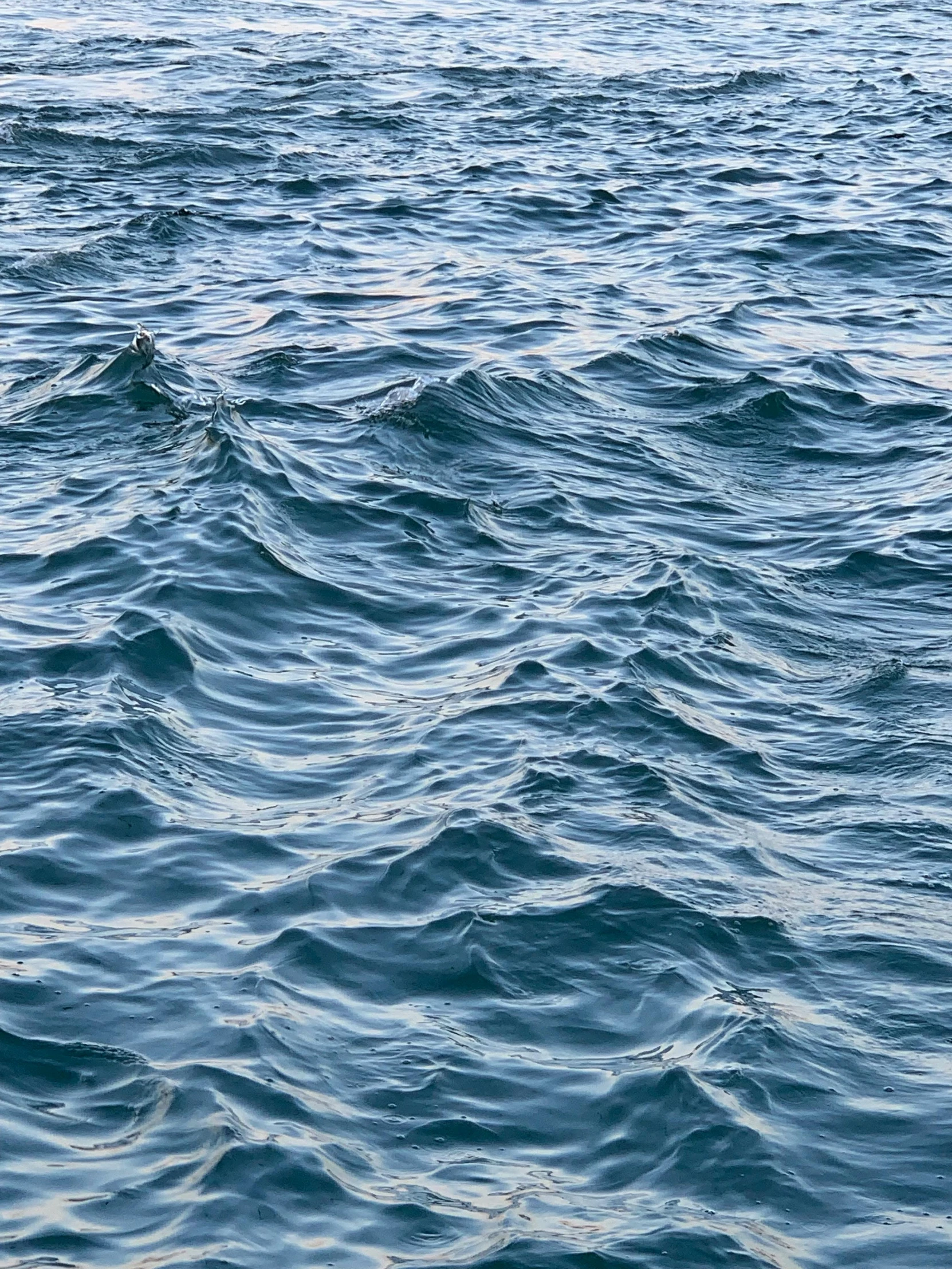 a close up of the water with large waves