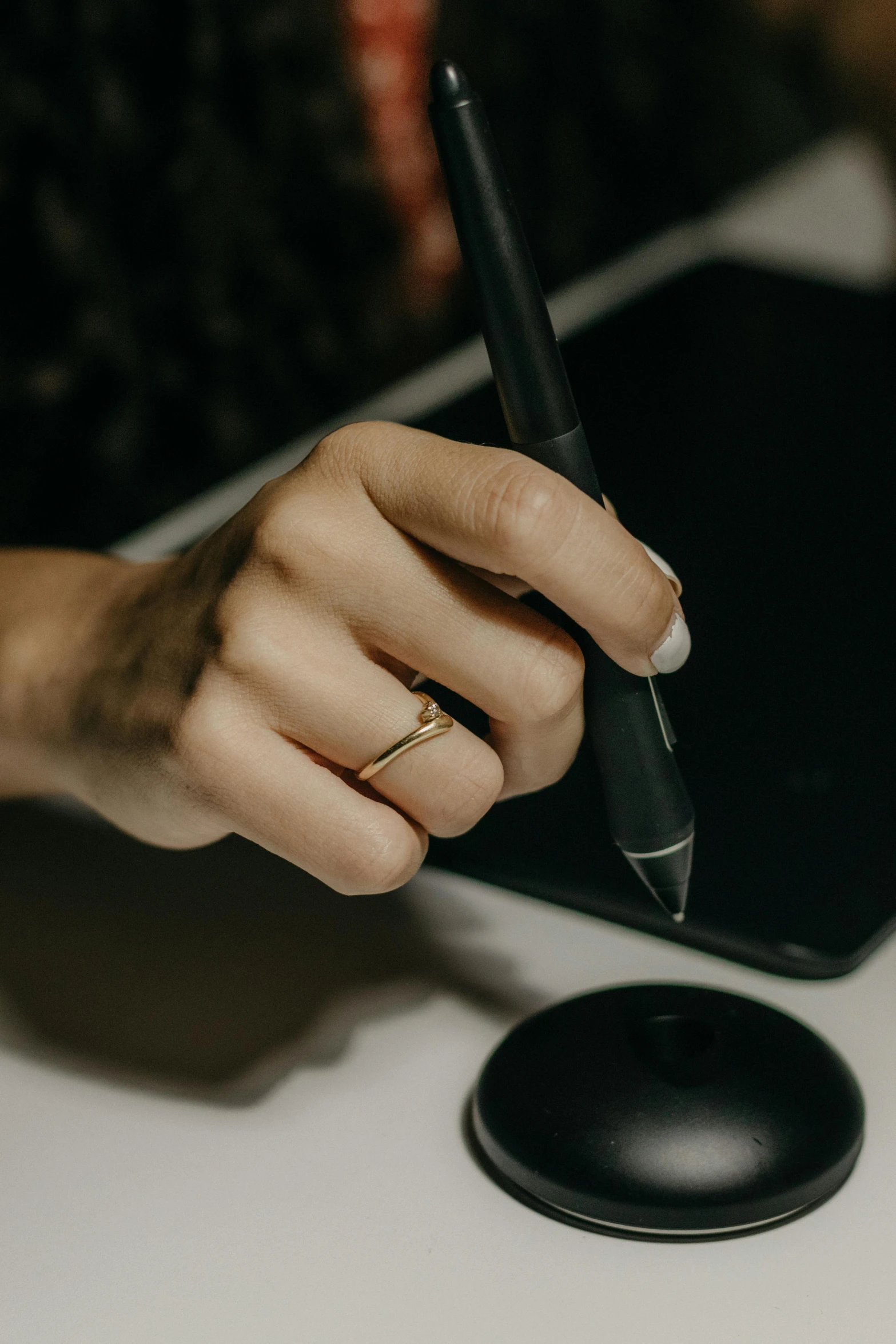 a close up of someone writing on a paper