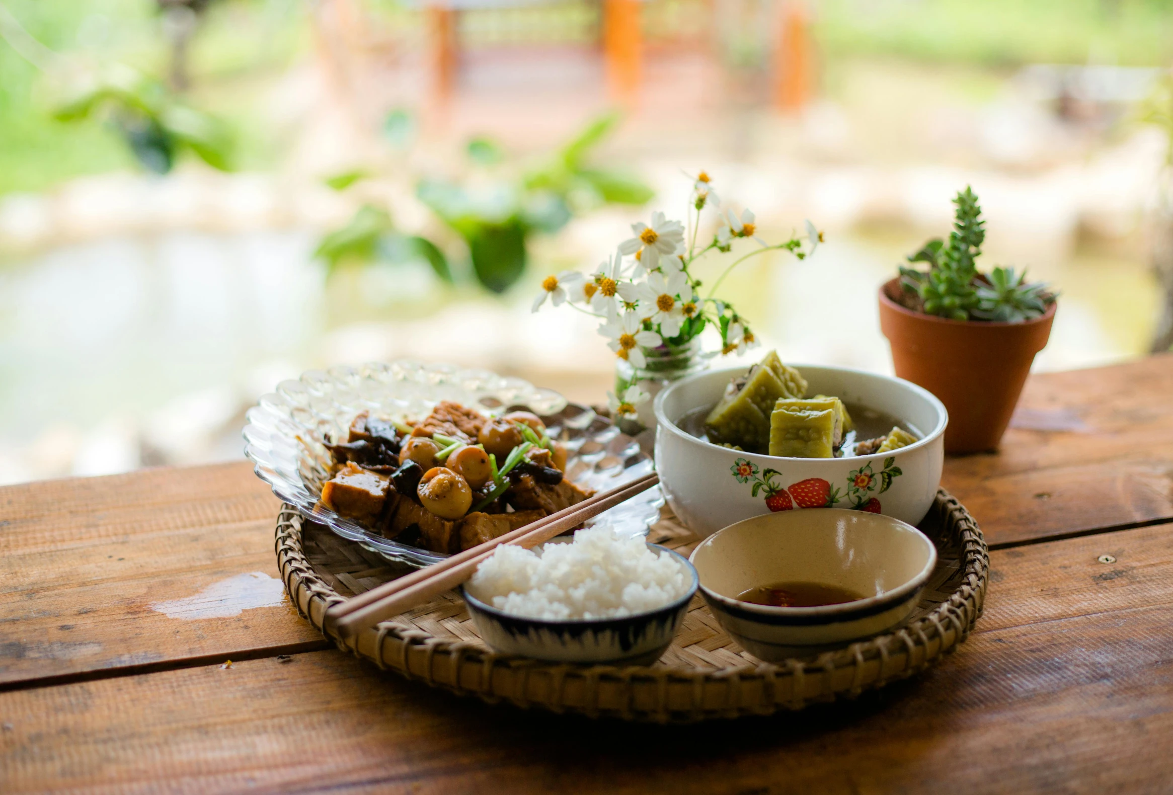 a plate with rice and vegetables sitting on top of it