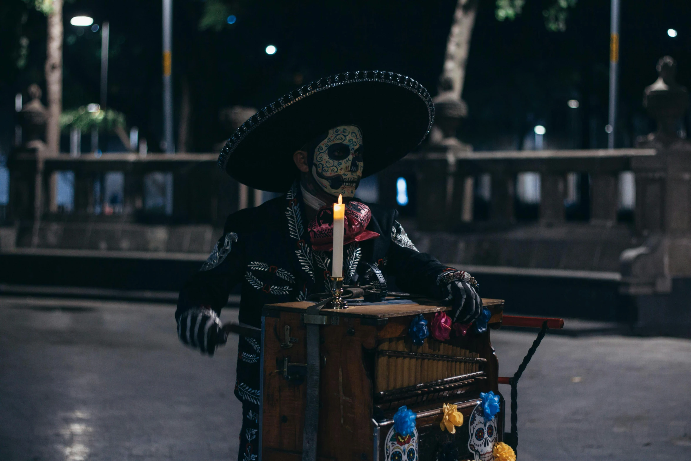 a costumed man with a hat and top hat