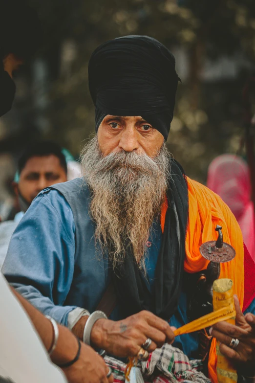 an old man with a long beard and a lot of oranges