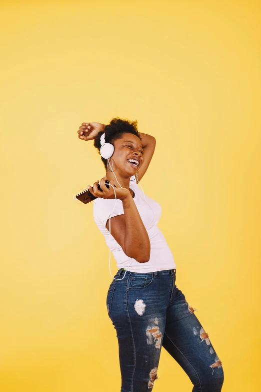 a woman is dancing while listening to music