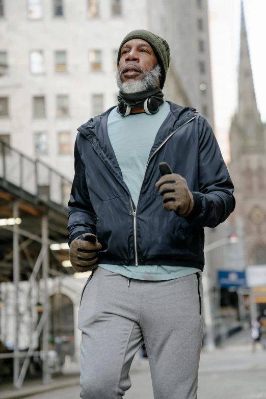 a man is standing outside in the city