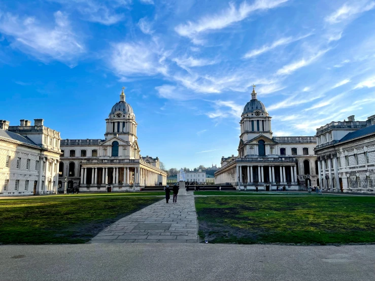 a building has a big lawn in the foreground