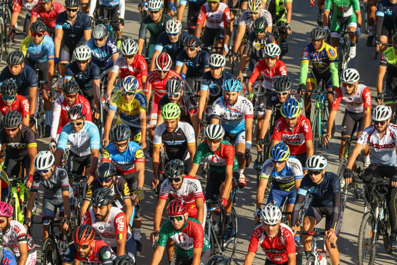 many cyclists are lined up at a race