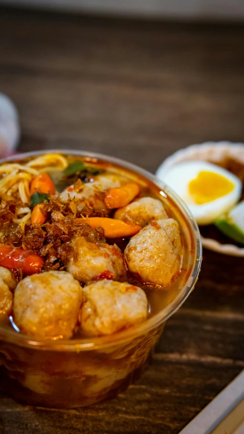 food items displayed in glass bowls on wooden table