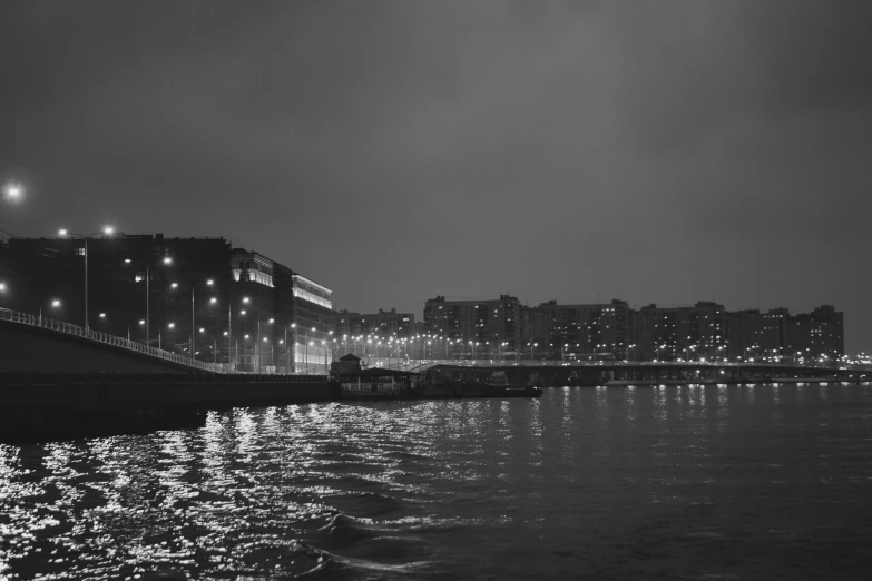 a night scene with water and lights