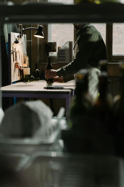 a man that is working on soing on a table