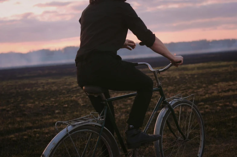 a person is riding a bike in the field