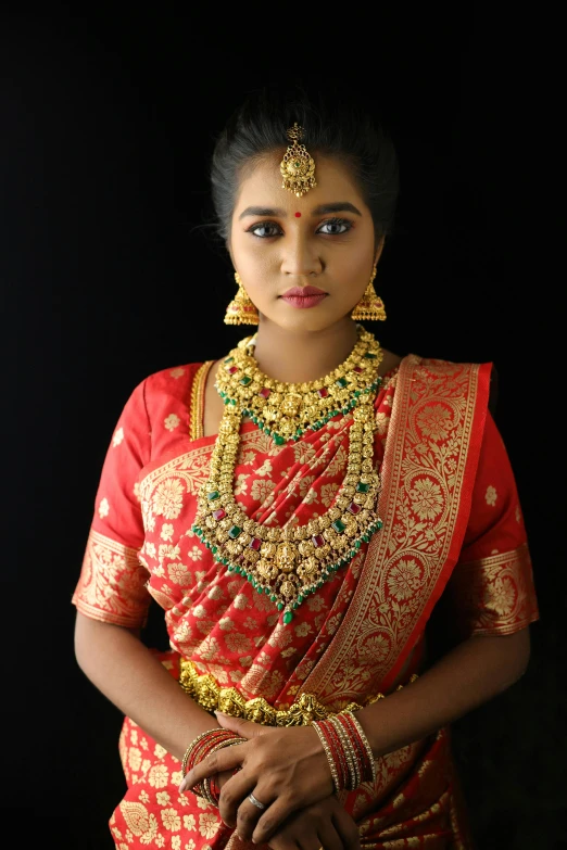 a woman in a red and gold dress