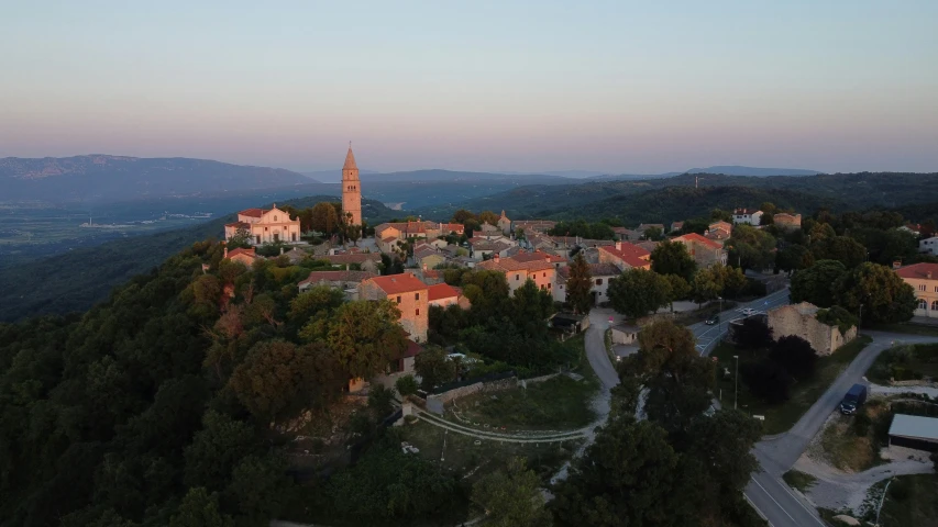 a bird's eye view of a small town with red roofs