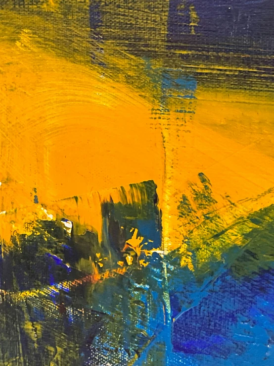 a painting of yellow and blue on a piece of wood