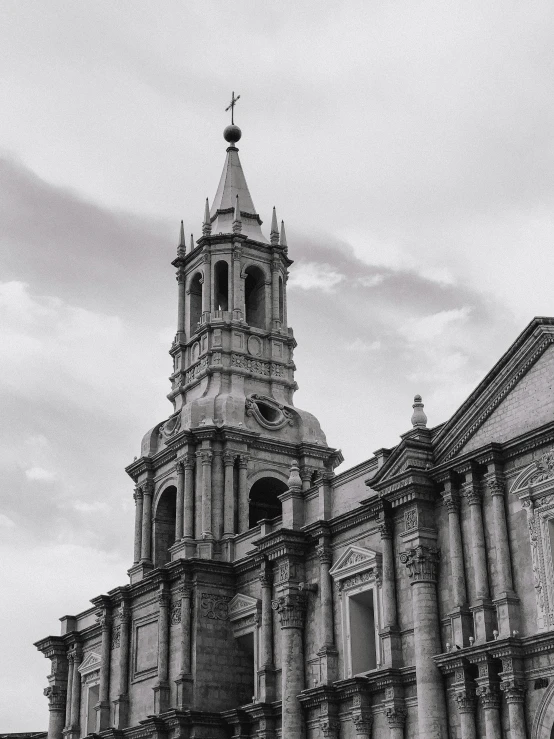 a black and white image of a tall church