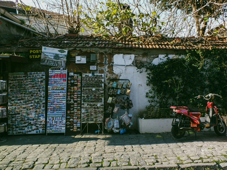 a motorcycle parked next to a store on the street