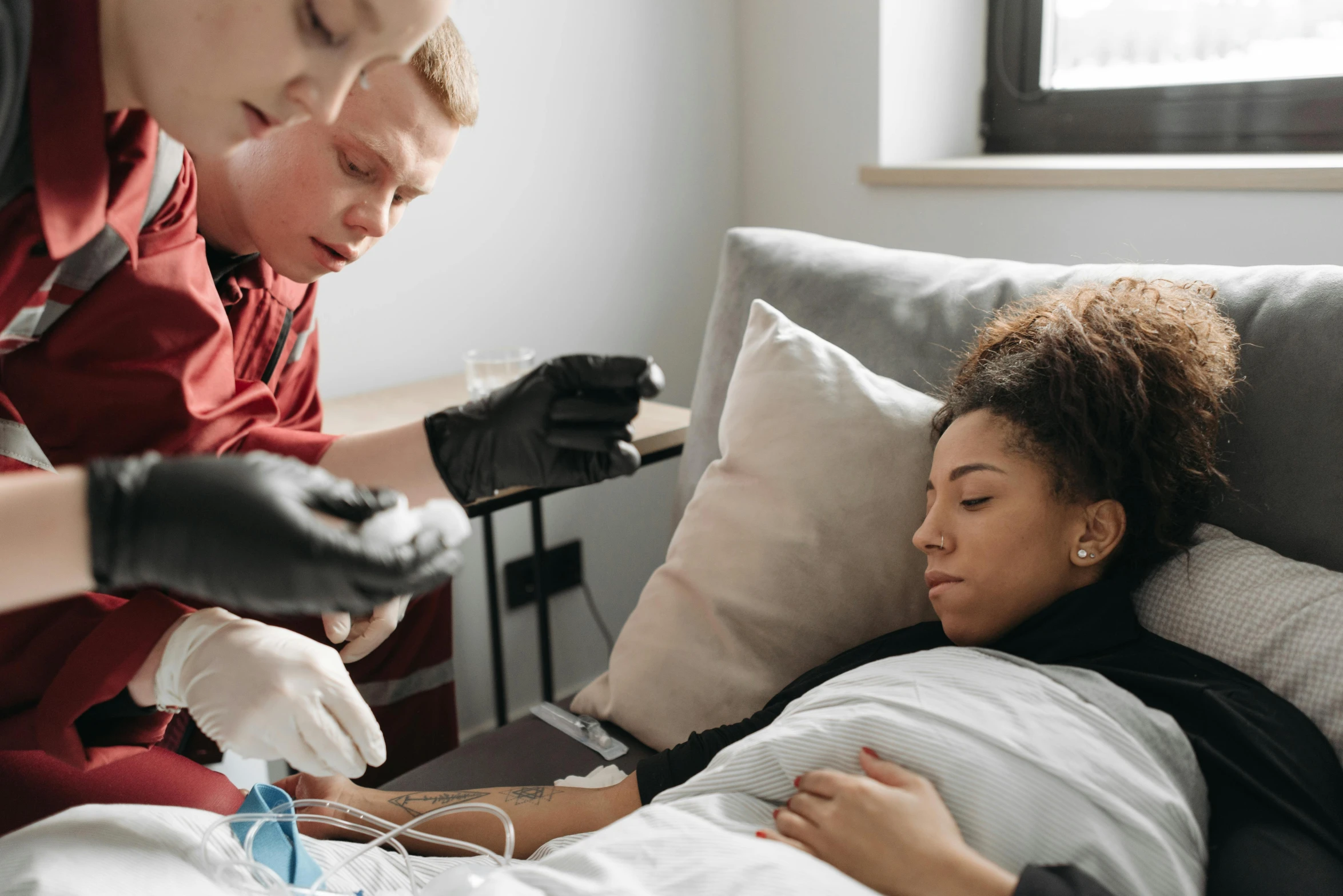 two women in the hospital with a female patient