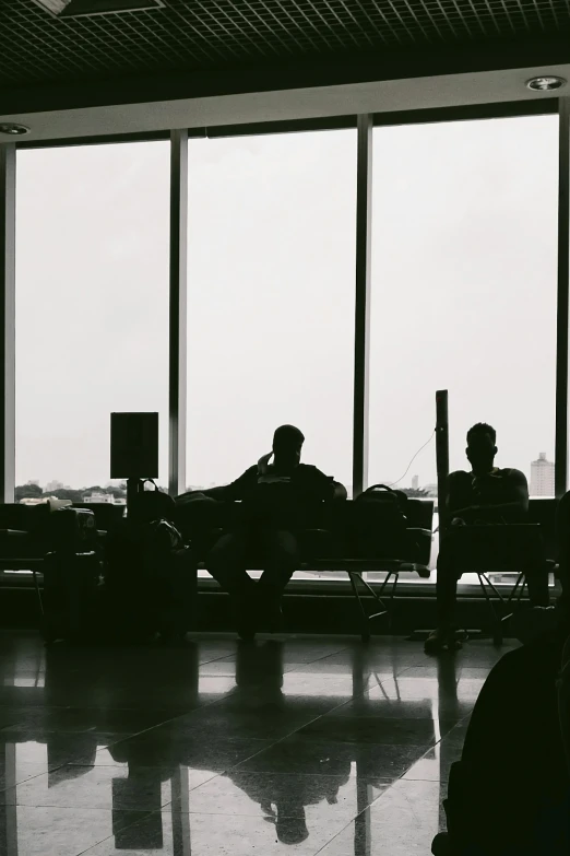 the people are waiting in the lobby with their luggage