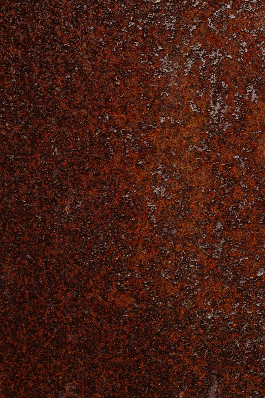 a red and black ground covered in small dots