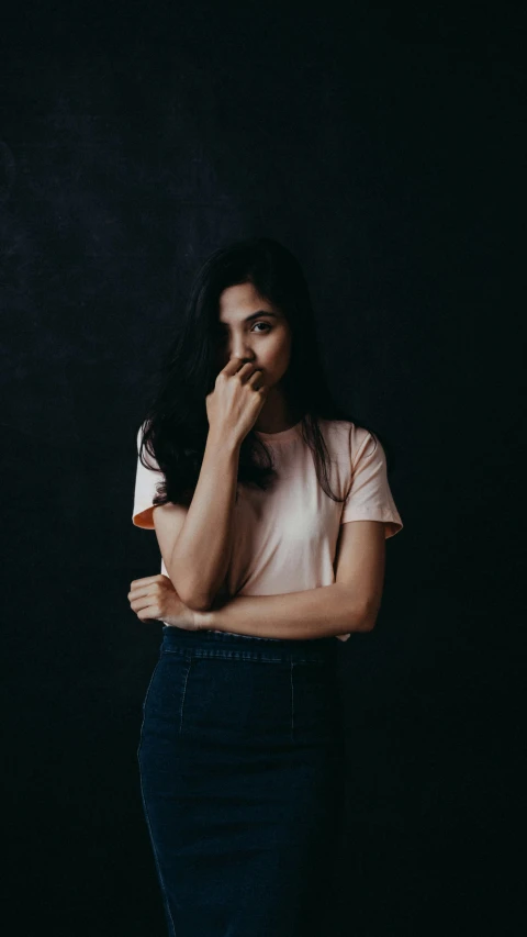 a woman in a white shirt is brushing her teeth