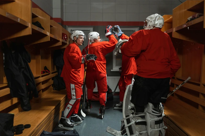 a team of athletes are looking in the locker