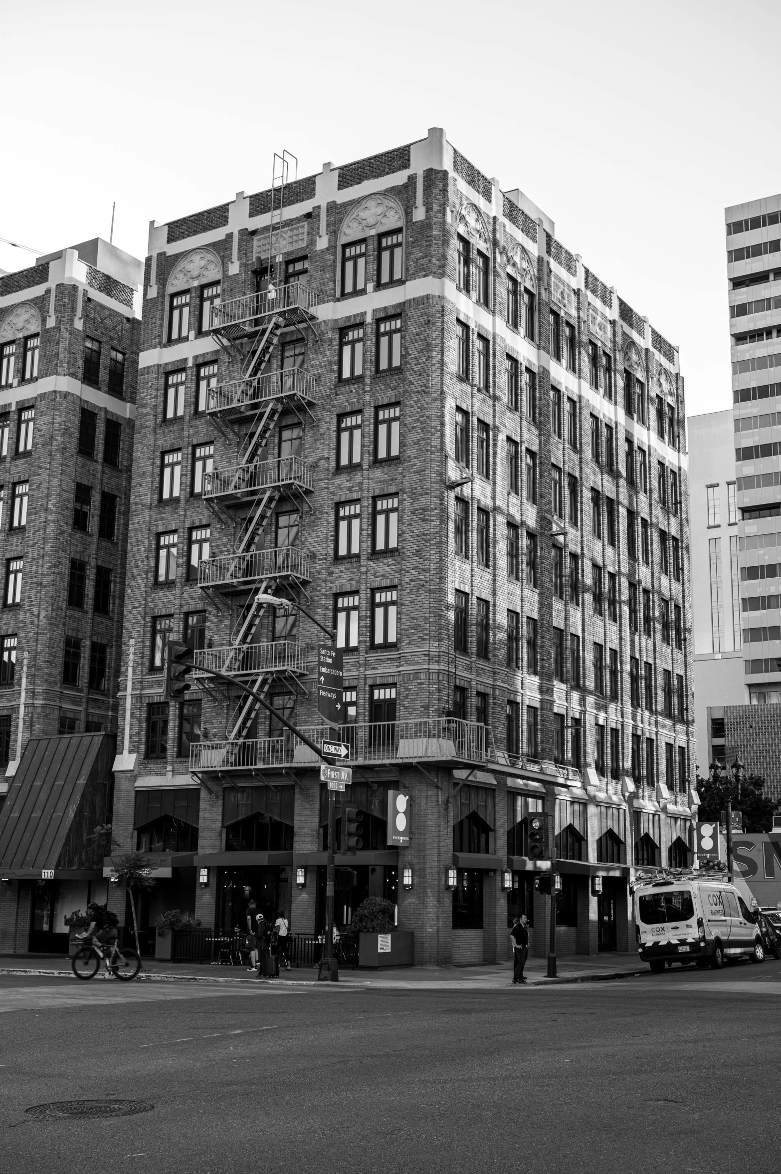 a couple of tall buildings sitting next to a street