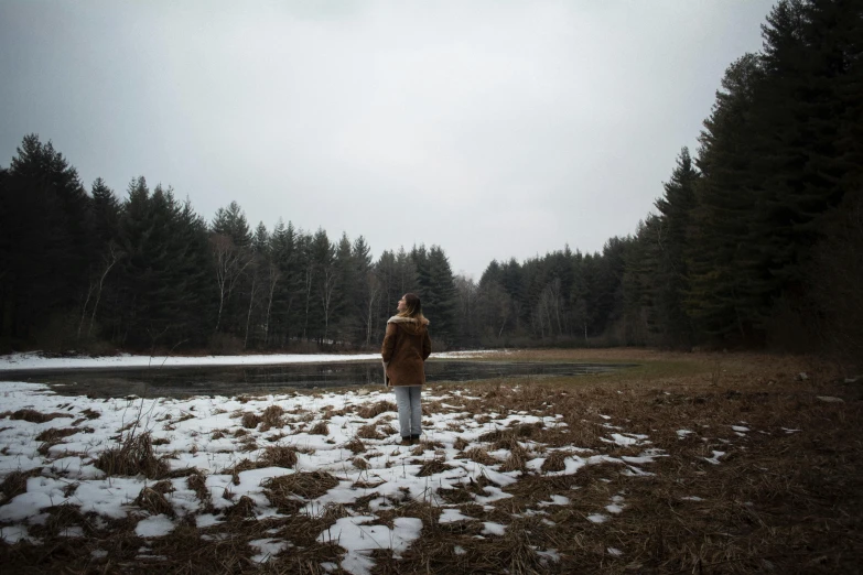 a person in the middle of a snowy field